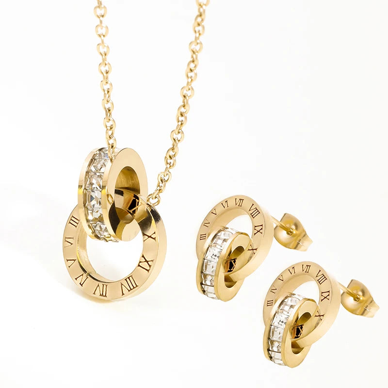 Boucles d'oreilles et collier plaqué or et argent avec cristaux et chiffres romains PAX Classic élégant